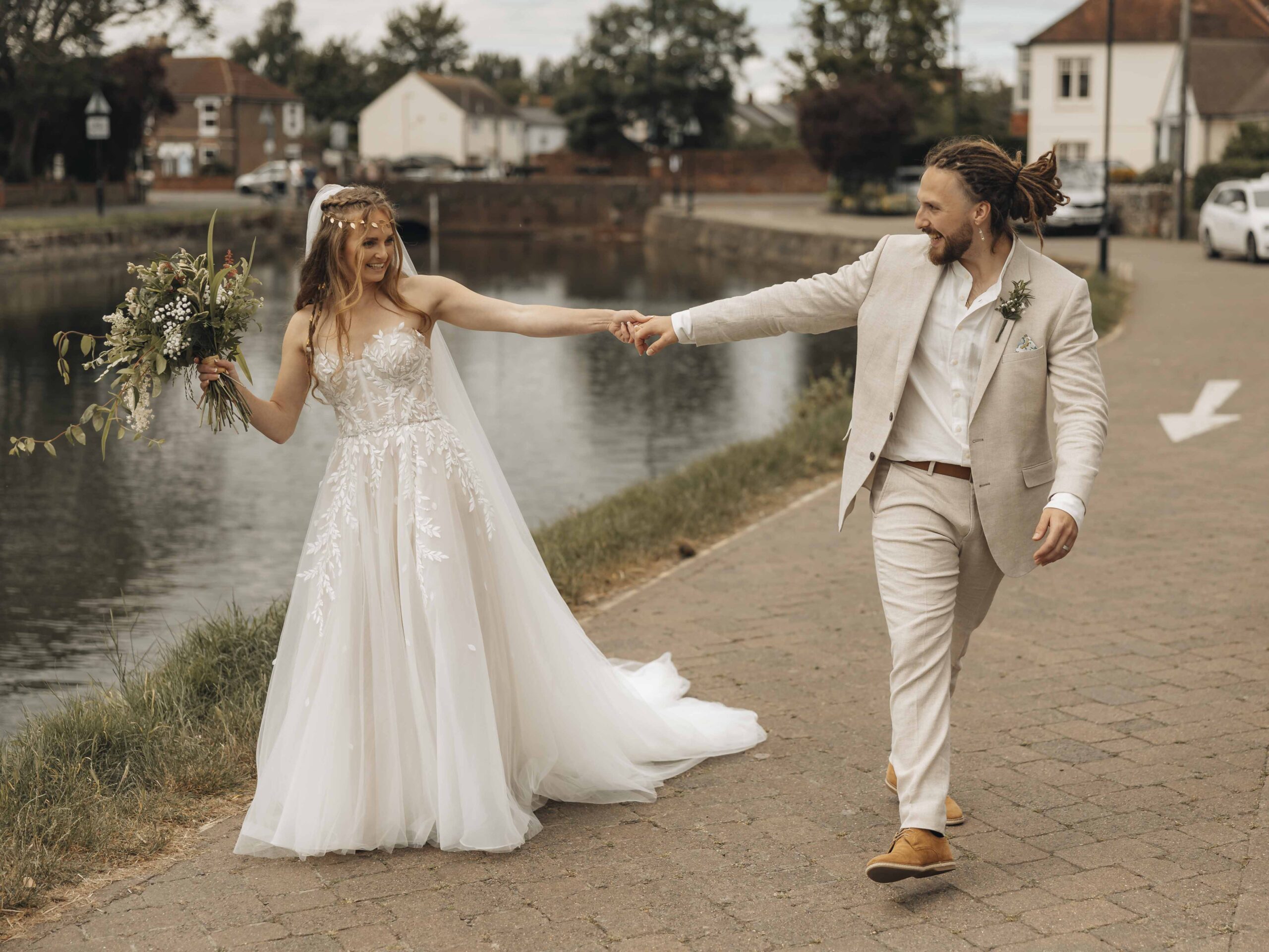 bride and groom walking at arms length