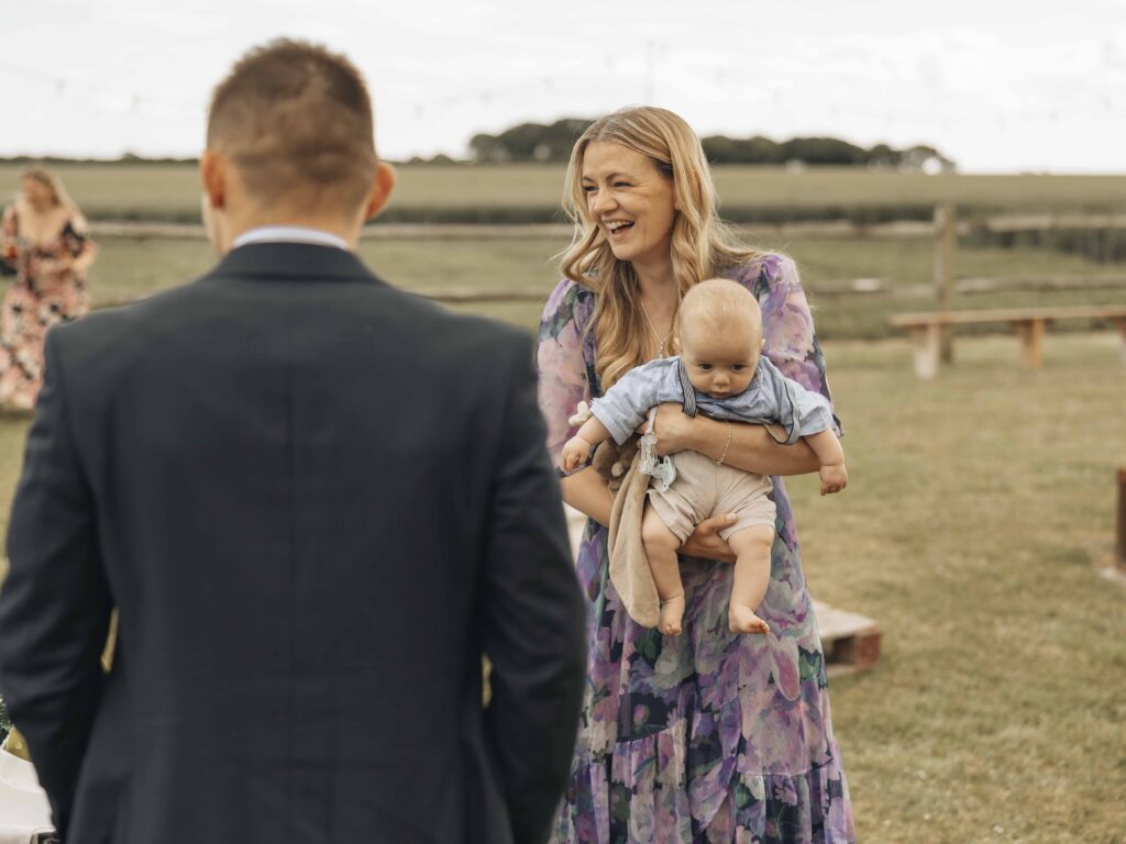 Lady with Baby at Wedding