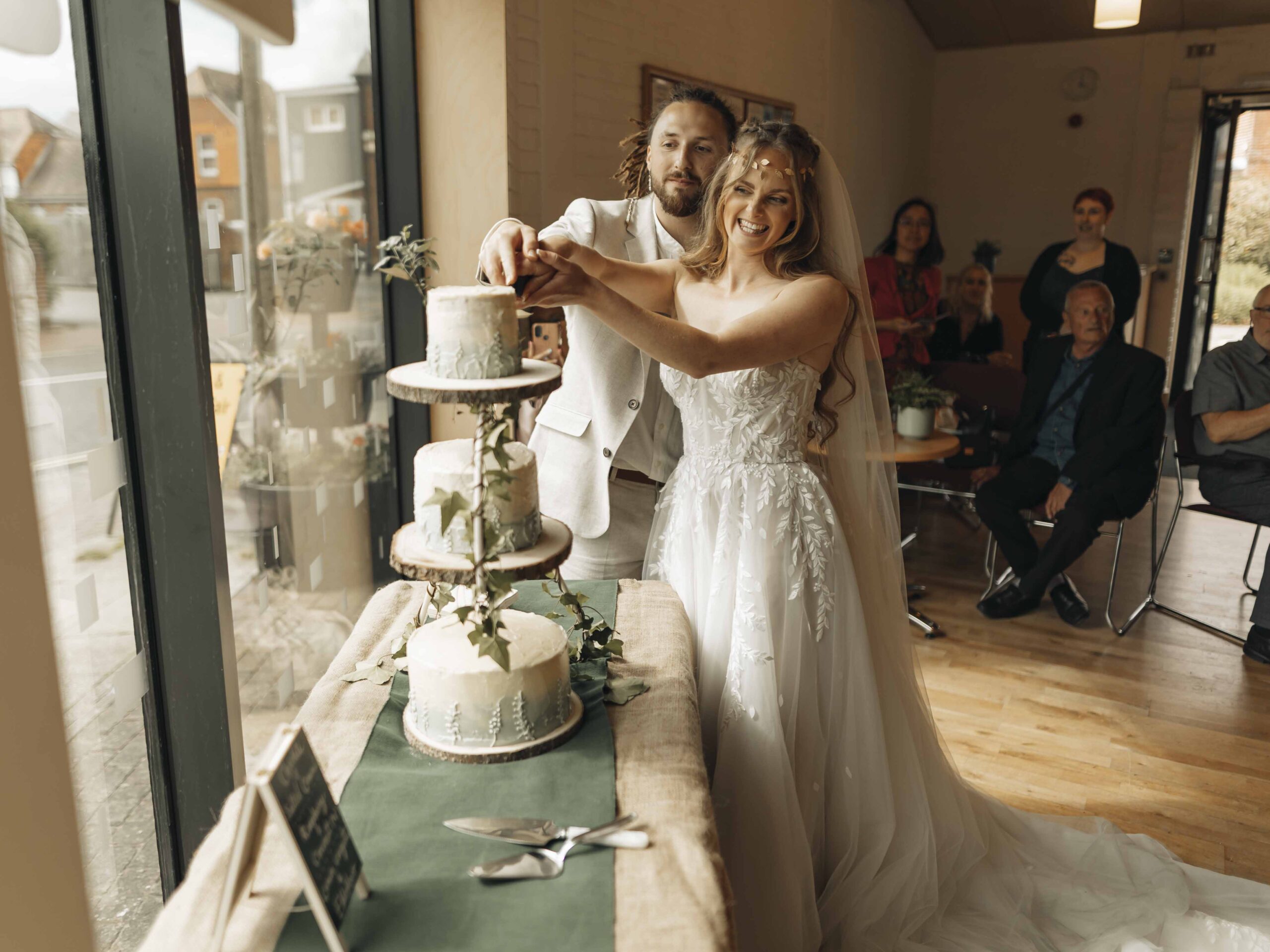 bride and groom cutting the cake