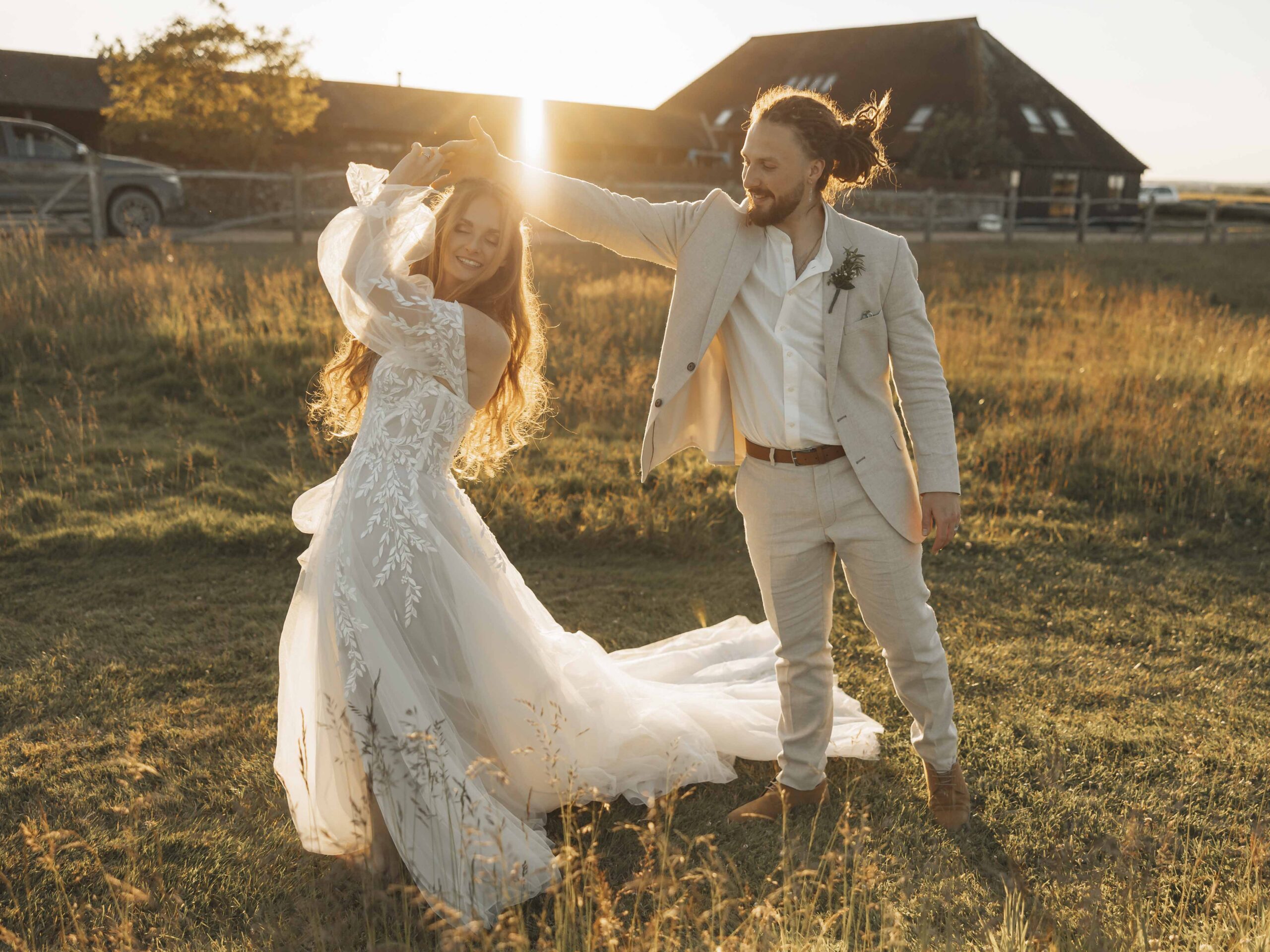 Bride and groom dancing during golden hour