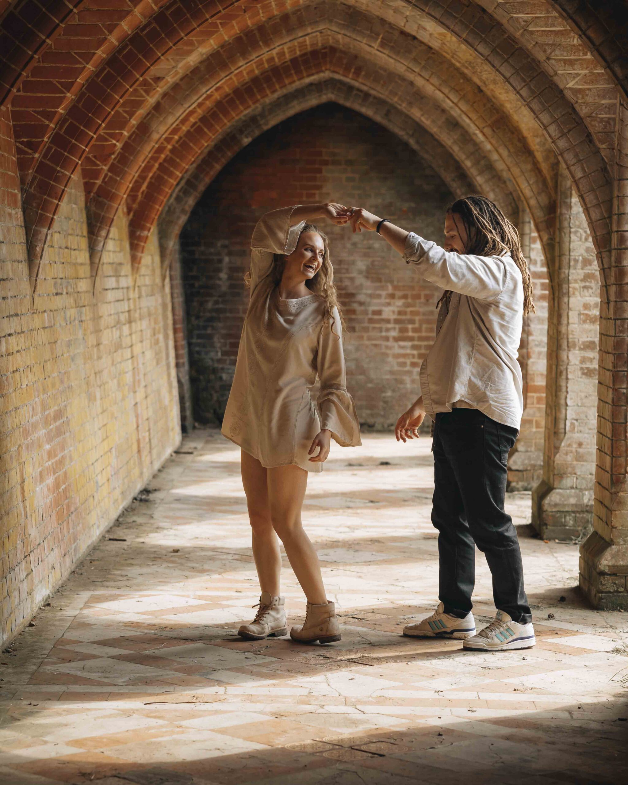 couple dancing under archway