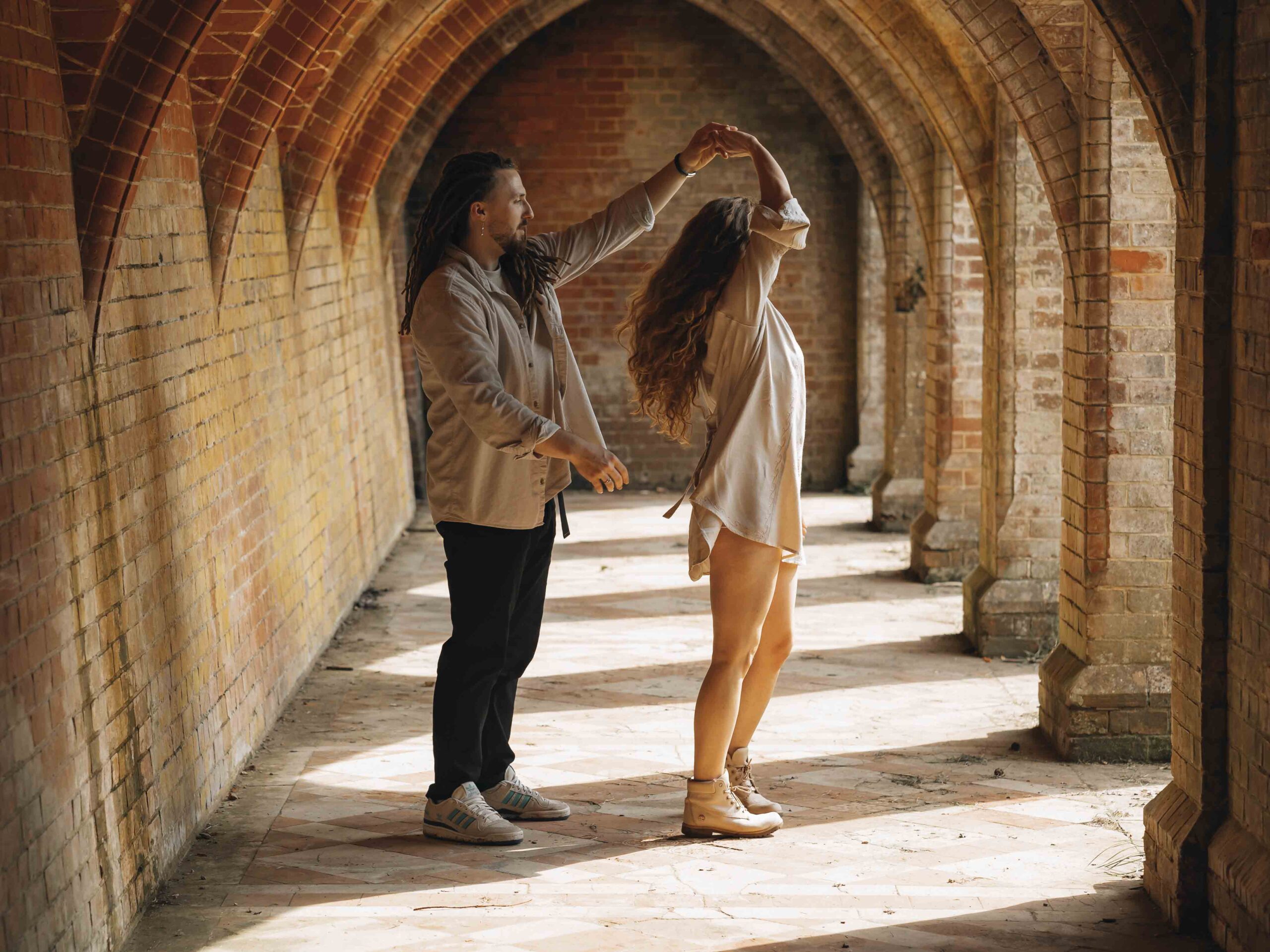 couple dancing slowly during engagement shoot