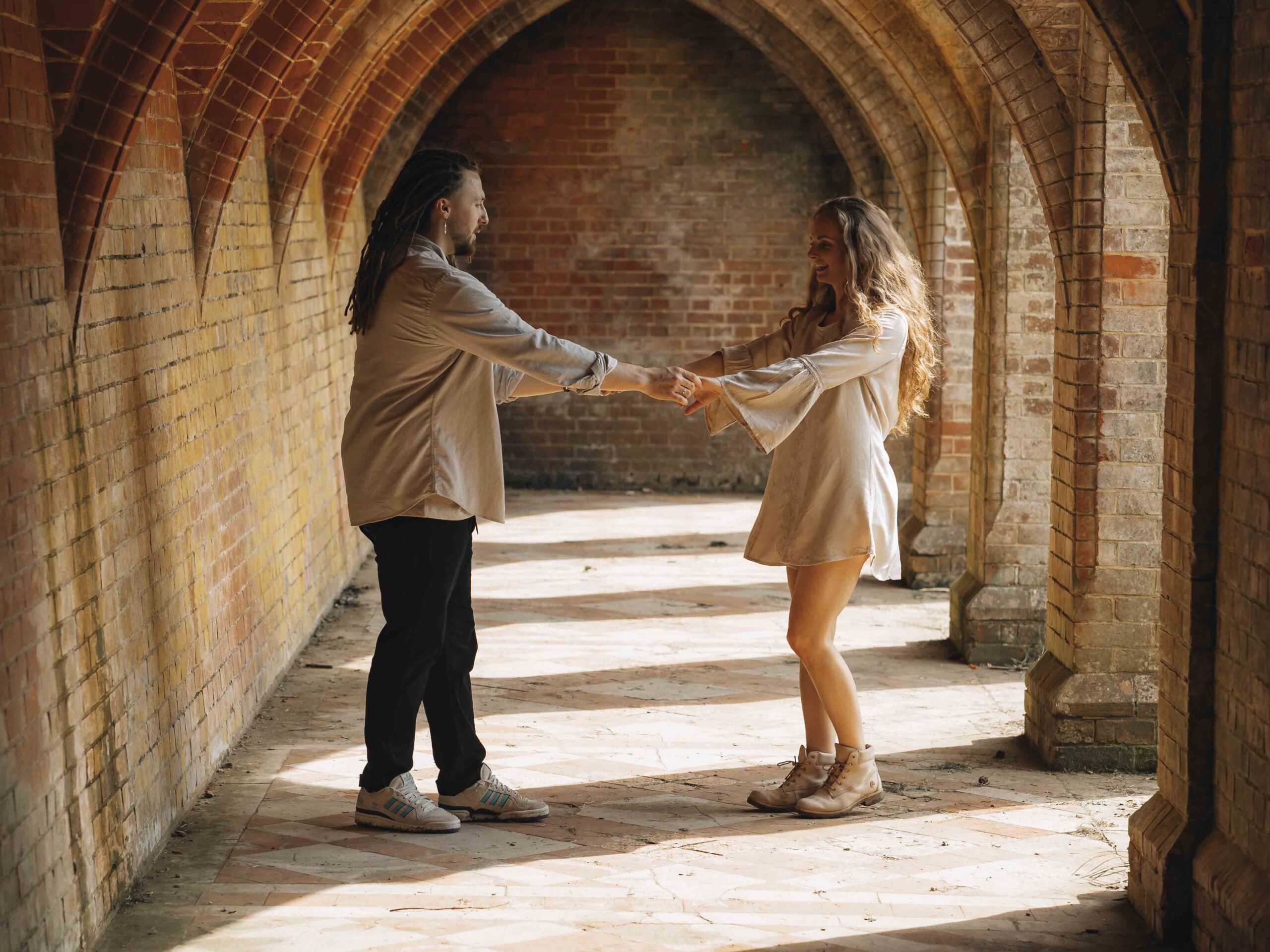 couple at arms length while dancing