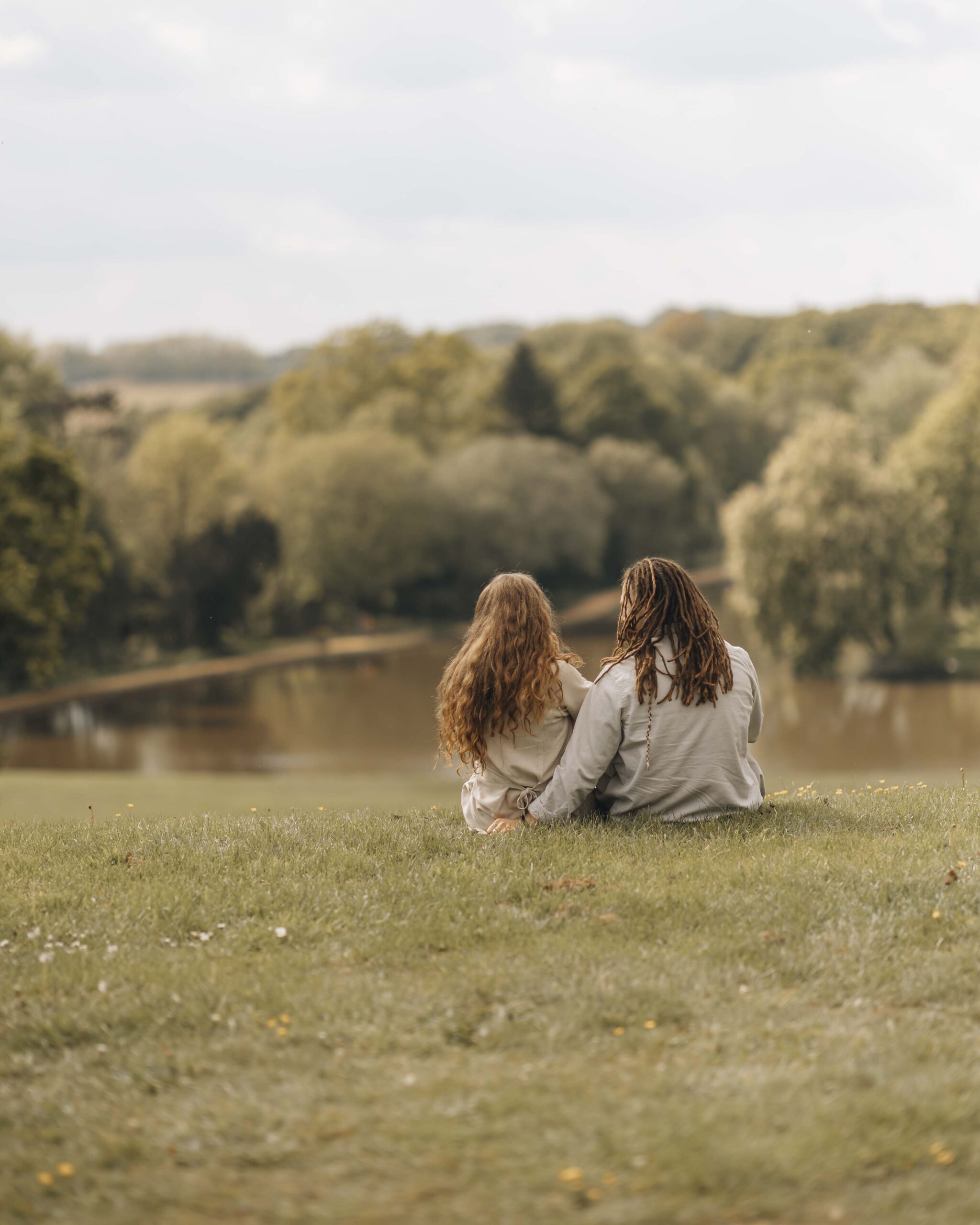 Couple sat on grass looking at the view